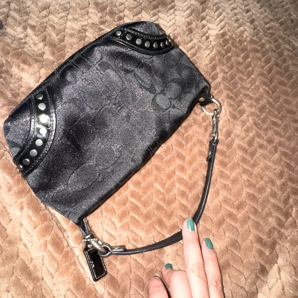 Coach black signature Collection mini bag.